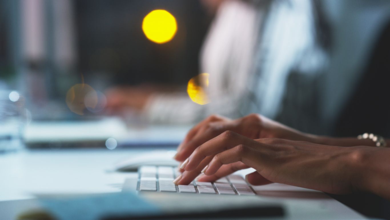 Hands typing on keyboard